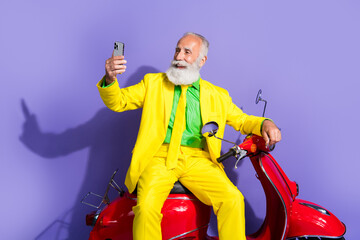 Canvas Print - Photo of nice funny senior gentleman wearing trendy costume sitting scooter isolated on purple color background