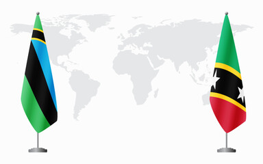 Zanzibar and Saint Kitts and Nevis flags for official meeting against background of world map.