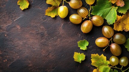 Sticker - A rustic arrangement of green grapes and autumn leaves on a dark surface.