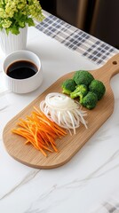 Wall Mural - Sliced onions, carrots, and vibrant broccoli are arranged on a wooden board with a bowl of brown sauce nearby, set against a blue and white checkered background