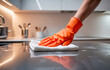 © tanya78 - hand in rubber glove cleaning kitchen, concept of cleanliness