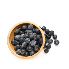 Wall Mural - Wooden bowl with fresh blueberry on white background