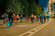 © svetlanais - Nighttime bike ride through city street with cyclists