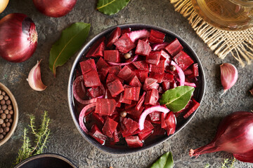 Sticker - Fermented red beet kvass in a dark bowl with onions, garlic, bay leaf and spices