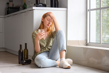 Poster - Young woman drinking alcohol at home. Concept of alcoholism