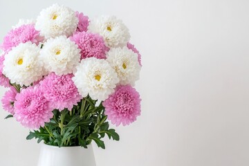 Wall Mural - A small pink vase with chrysanthemums and angelica lilies on a white background