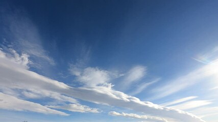 Wall Mural - timelapse 4k of beautiful blue sky with fluffy clouds background, blue sky with clouds and bright su
