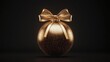 © thanawat - A stunning gold ornament with a beautiful bow on a dark background, perfect for holiday themes and celebrations.