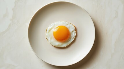 Canvas Print - Delectable Fried Egg on a Minimalist White Plate