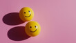 © Ice Cream Paradise - emotional, mood, excitement concept: three yellow balls with joyful, excited faces arranged in a playful, bouncy pattern against an isolated soft pink background