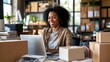© Brynjar - A woman working on a laptop surrounded by boxes in a bright, organized workspace.