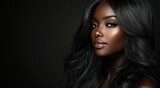 A close-up portrait of a beautiful black woman with long shiny hair and make-up . Haircare, beauty and cosmetics concept.
