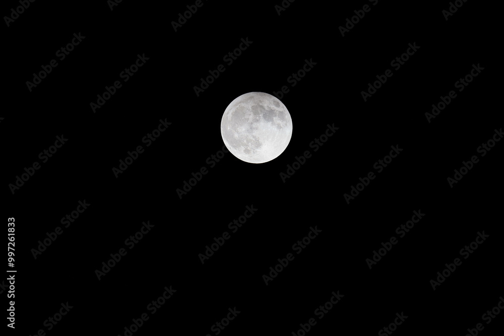 The partial lunar eclipse moon with dark sky on September 17, 2024 ...