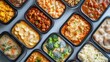© Paul - Frozen ready meals with a variety of frost-covered dishes like lasagna, curry, and stir-fries, viewed from above in an organized layout
