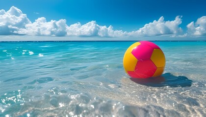 Joyful beach scene with colorful balls splashing in bright blue water beneath a sunny sky filled with fluffy clouds