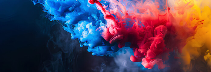 Black background with colorful paint and smoke, red blue yellow pink color ink in a water explosion abstract background