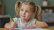 © Daniel L - A young girl in kindergarten or pre-school looking thoughtful while drawing on a piece of paper. She has pigtails and has a slight smile on her face. School setting.