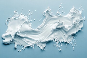 Elegant water splashes forming smooth waves on a serene blue background for cosmetic product advertising