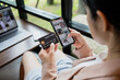 © Ton Photographer4289 - Woman hand holding credit card and smartphone for paying online using banking service. Online shopping concept