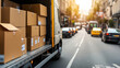 © tong2530 - A delivery truck loaded with neatly stacked boxes, ready for transportation, parked on a busy street