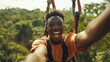 © siripimon2525 - Joyful Young Man Ziplining Through Lush Landscape