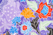 © gamjai - A traditional batik Indonesian fabric with flowers pattern texture.