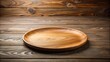 © Prasert - Empty round wooden plate on wooden table background