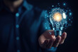 © oksa_studio - Businessman holding light bulb connected with network representing innovative idea