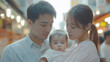 © Humans - Asian families. Father, mother, and baby. Expressions of joy, sadness, and surprise.