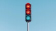 © Gefo - Red and green traffic light against a clear blue sky