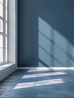 © Izzain - Sunlight streams through a window, casting long shadows across a blue wall and hardwood floor in a modern room.