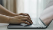 © bixpicture - Close-Up of Hands Typing on Laptop Keyboard in a Bright Workspace. Representing Digital Work, Remote Productivity, and Online Communication. Concept of Modern Business, Technology, and Connectivity