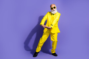 Poster - Full size photo of elegant charismatic aged man perform dance yellow suit isolated on violet color background