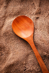 Vertical picture of a full size wooden spoon 