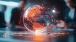 © Kasitthanin - Digital globe with fiery tones, representing innovative global connectivity.