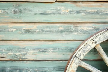 Weathered wooden wall and rustic wheel detail in countryside setting during bright daylight