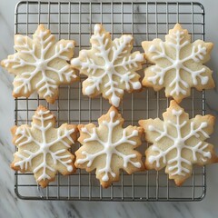 Poster - Snowflake-shaped cookies decorated with white icing on a cooling rack.