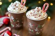 © Eugen - Hot cocoa with whipped cream and marshmallows. Christmas hot chocolate treatA mug of hot cocoa topped with whipped cream, marshmallows, and a candy cane, perfect for cozy Christmas evenings