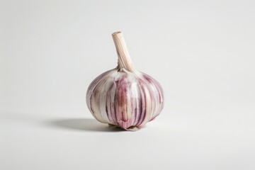 Poster - A close-up shot of a garlic bulb on a white surface