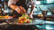 © Ruslan Gilmanshin - A skilled chef is preparing a beautifully plated dish in a kitchen