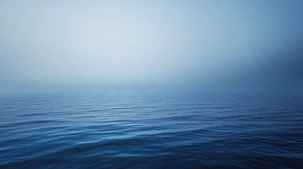 Dark blue ocean background with ripples and distant fog, creating a serene flat perspective