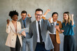 © NDABCREATIVITY - Success group of multiethnic entrepreneurs and business people achieving goals in corporate office