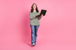 © deagreez - Full body portrait of pretty aged lady walk use netbook wear shirt isolated on pink color background