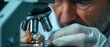 © Starkreal - Scientist Examining Diamond Under Microscope
