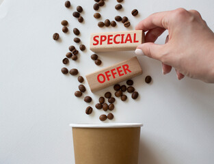 Special offer symbol. Concept word Special offer on wooden blocks. Businessman hand. Beautiful white background with coffee cup. Business and Special offer concept. Copy space