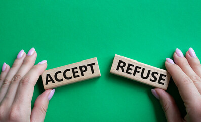 Accept or Reject symbol. Concept word Accept or Reject on wooden blocks. Businessman hand. Beautiful green background. Business and Accept or Reject concept. Copy space