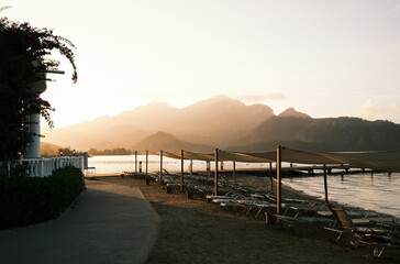 View of beach and mountains at sunset