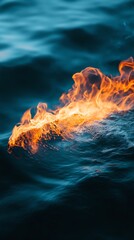 Captivating image of flames emerging from water, showcasing the contrast between fire and liquid elements in nature.