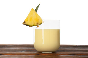 Poster - Tasty pineapple smoothie in glass and slice of fruit on wooden table against white background