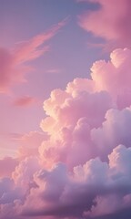 Aufkleber - A breathtaking view sky filled with fluffy white and pink clouds, with a gradient of colors transitioning from pink to purple, creating a serene and dreamy atmosphere